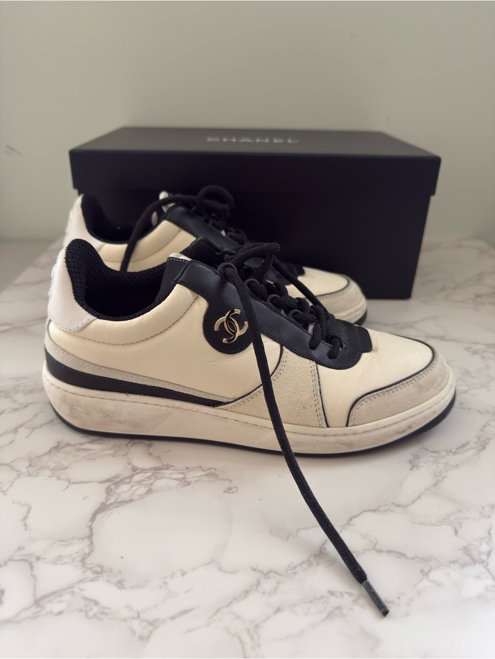 CHANEL Leather Cream and Black CC Charm Low-Top Sneakers